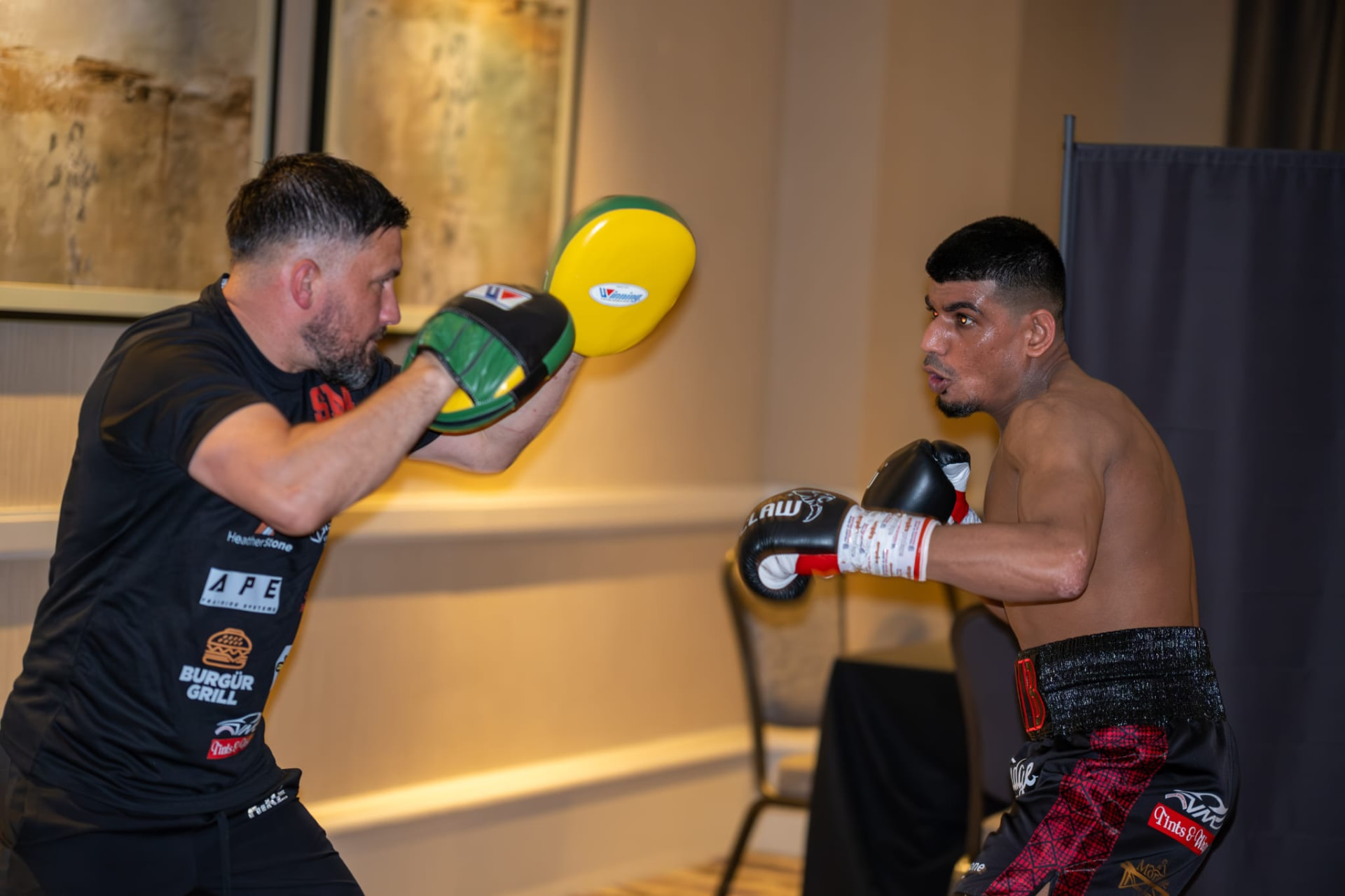 Sohaib Mohammed working the pads with his coach